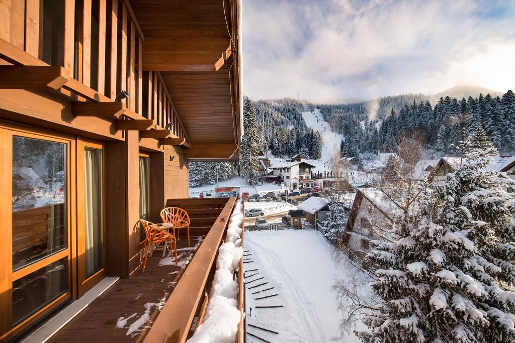 Balcony overlooking snowy ski slopes 