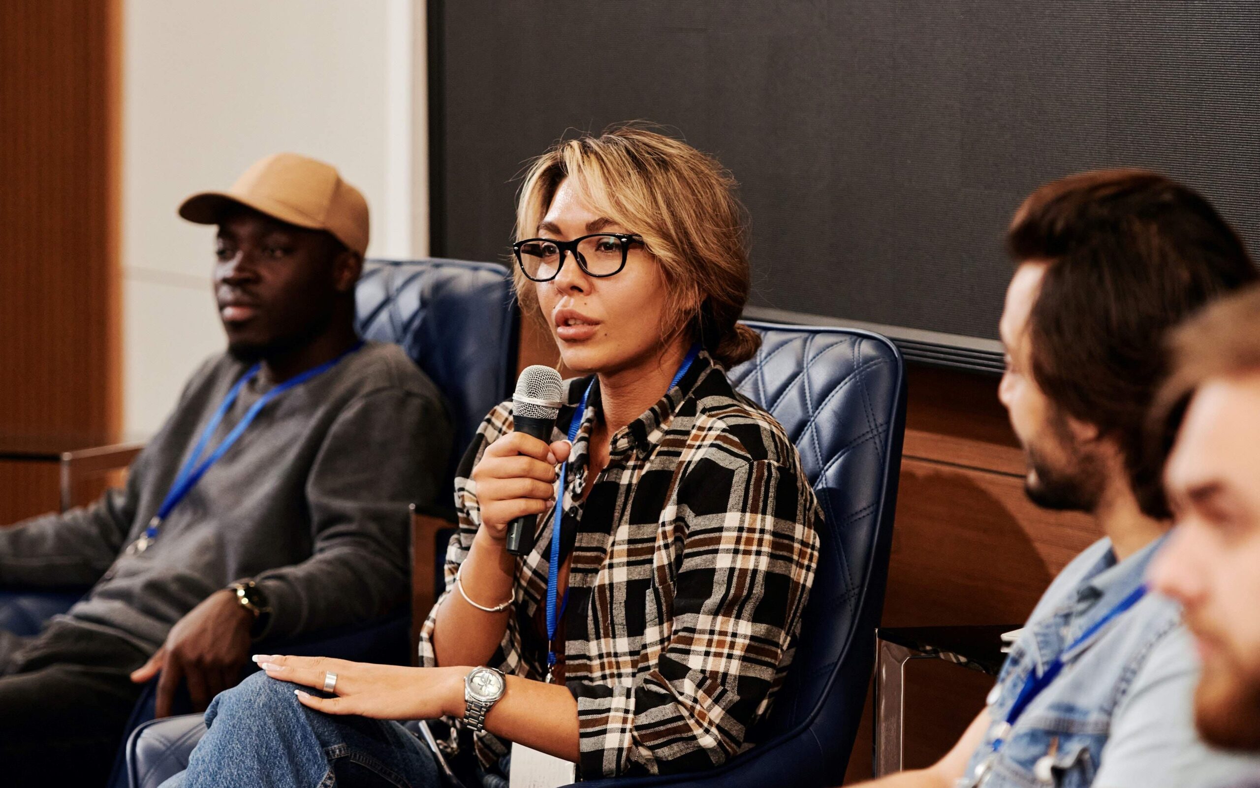 A female motivational speaker speaking on microphone 