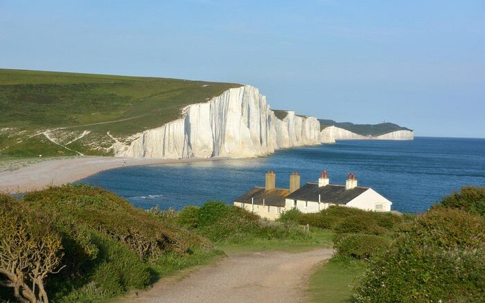 White cliffs and traditional East Sussex house by the sea